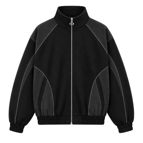 A black zip-up track jacket with contrasting dark gray panels on the shoulders, sides, and lower front, accented by thin silver contrast stitching. The jacket features a high stand-up collar, a central silver zipper, elasticized cuffs, and a ribbed hem, shown against a plain white background.